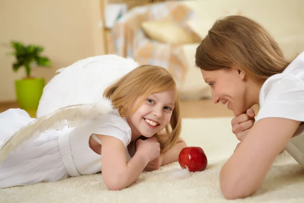 Girl and her mother with a present — Stock Photo, Image