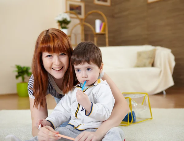 Young mother playing with her little son — Stock Photo, Image