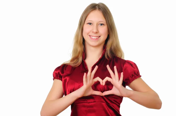 Una ragazza adolescente in studio con il simbolo del cuore — Foto Stock