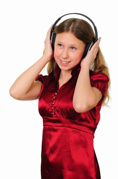 Uma adolescente no estúdio com fones de ouvido — Fotografia de Stock
