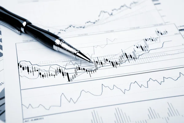 stock image Financial charts and graphs on the table