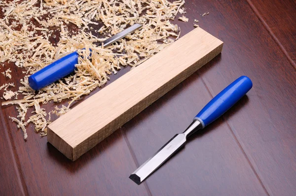Two Bits Blue Background Wood Shavings Royalty Free Stock Images