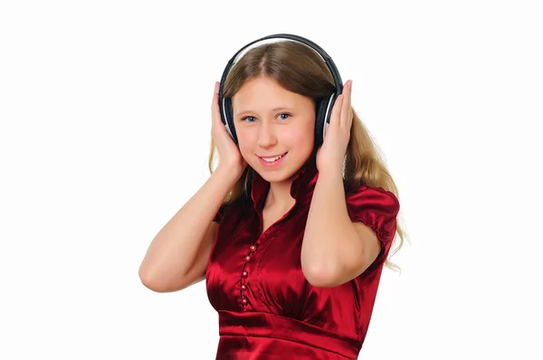 Een tienermeisje in studio met koptelefoon — Stockfoto