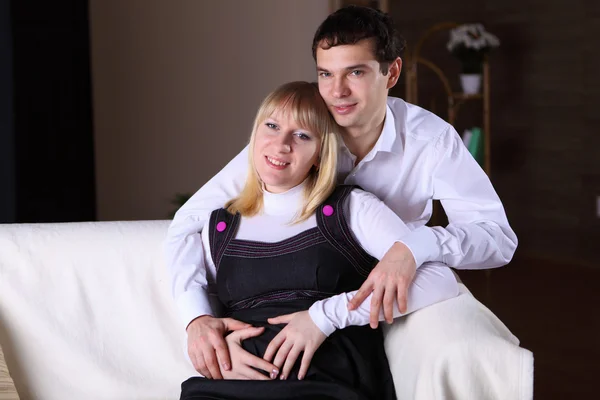 Pregnant wife and her husband at home — Stock Photo, Image