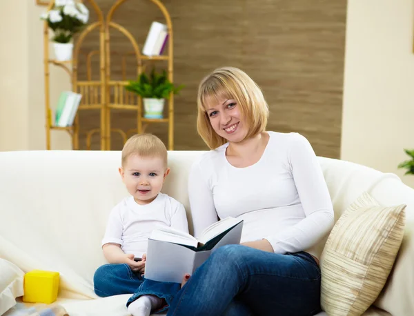 Young Mother Reading Book Her Little Son Home — Stock Photo, Image