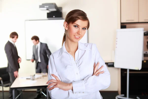 A young business woman in office — Stock Photo, Image