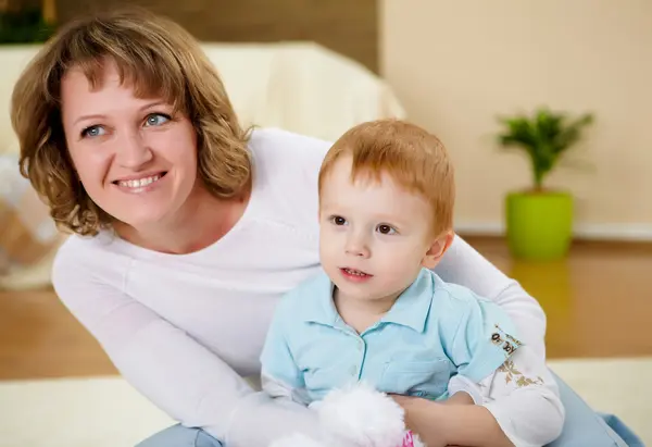 stock image Mother and son at home on the floor