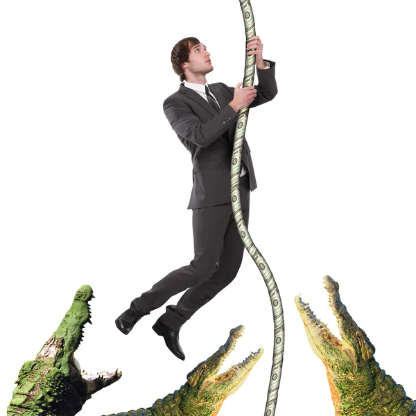 Business man climbing up from crocodiles — Stock Photo, Image