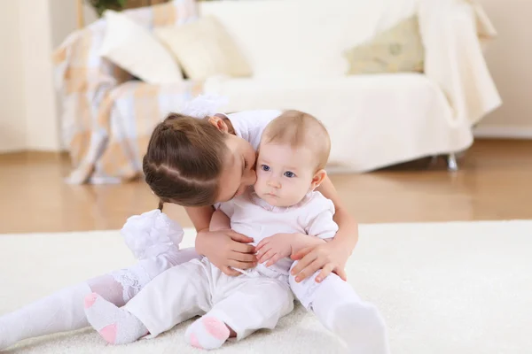 stock image Two little sisters together at home