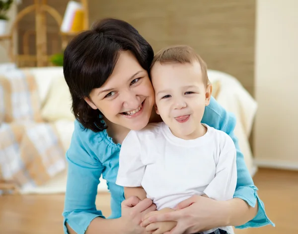Mother and son at home on the floor — Stock Photo, Image