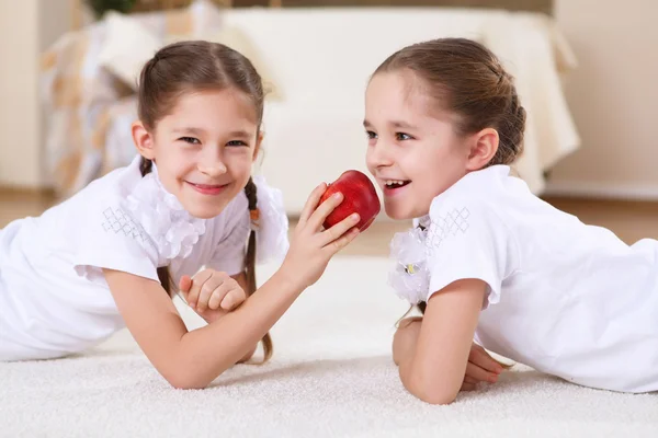 stock image Twin sisters together at home