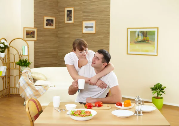 Husband and wife at home in the kitchen — Stock Photo, Image