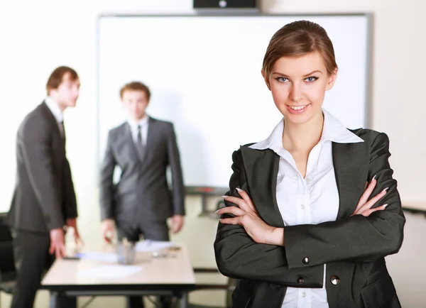 A young business woman in an office — Stock Photo, Image