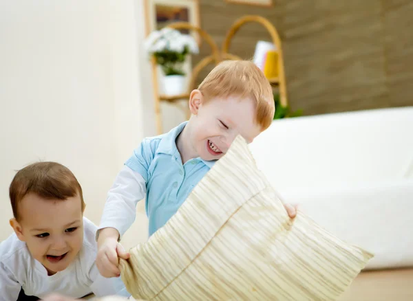 Two happy smiling and laughing boys at home — Stock Photo, Image