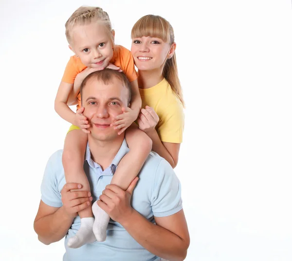 Familj med en liten dotter som gör idrotten tillsammans — Stockfoto