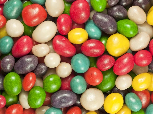 Stock image Colorful background of candy with raisins.