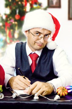 Business man as Santa at Christmas and New Year holidays clipart