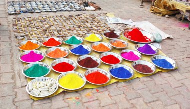 Colourful indian natural plant paints on the market clipart