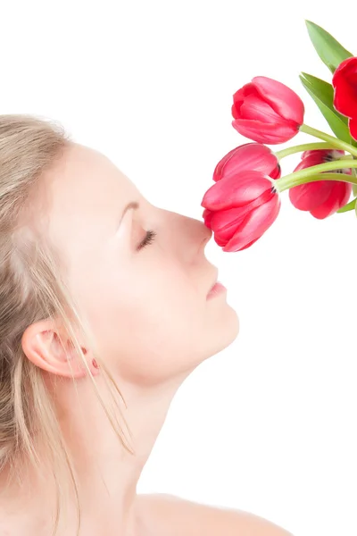 Woman smells bunch of flowers — Stock Photo, Image
