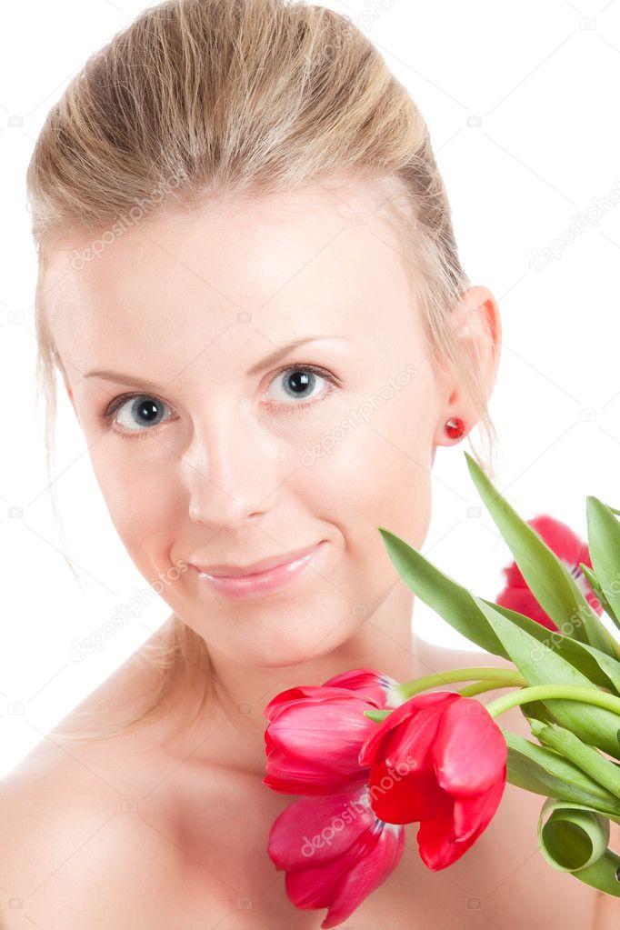 Young woman with bunch of tulips