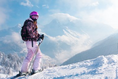 Woman skiier. The Alps clipart