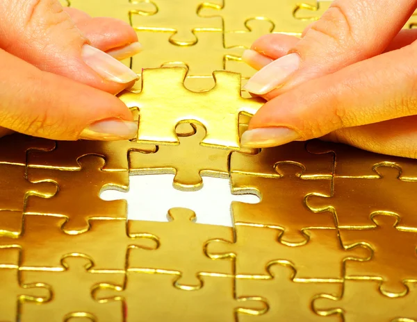 Gouden puzzel — Stockfoto