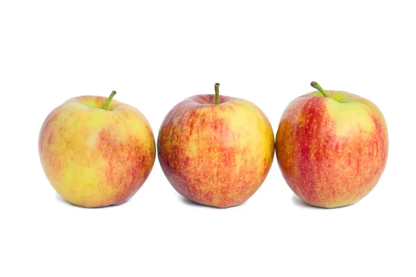 Tři červená jablka — Stock fotografie
