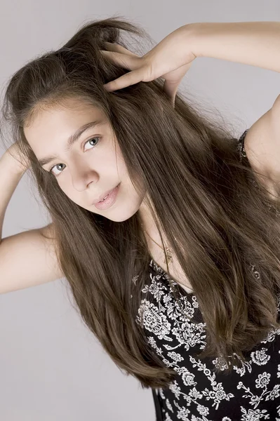 stock image Young girl holding her head