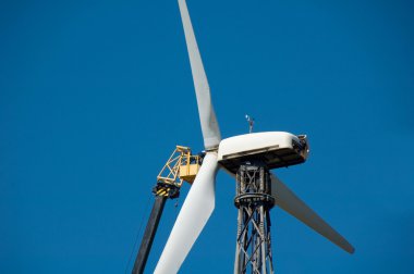 Man repairs windmill clipart