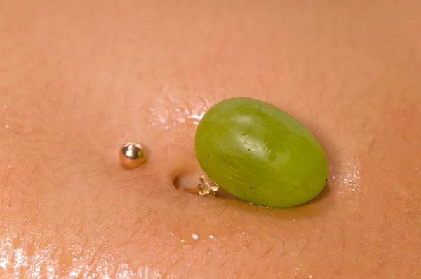 Stock image Grapes lying on a woman's body