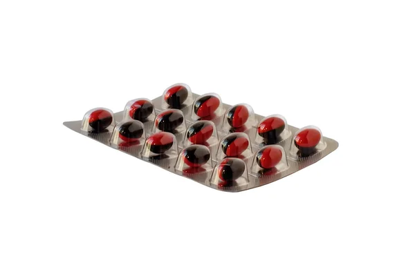 Červené pilulky v blistru — Stock fotografie