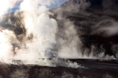 Vapor rising from geyser field, Chile clipart