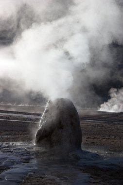 Mineral column formed by erupting geyser, Chile clipart