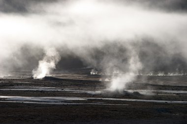 Mist rising from geyser field, Chile clipart