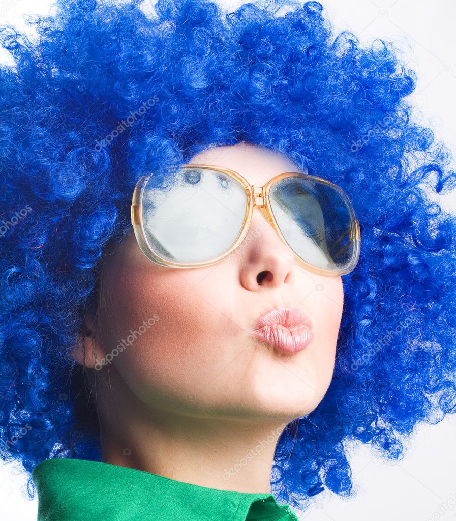 Happy woman in blue wig in Sunglasses