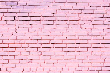Pink brick wall texture on street