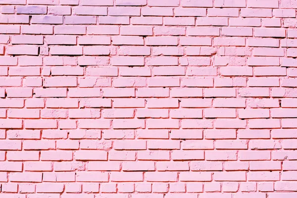 Roze bakstenen muur textuur op straat — Stockfoto
