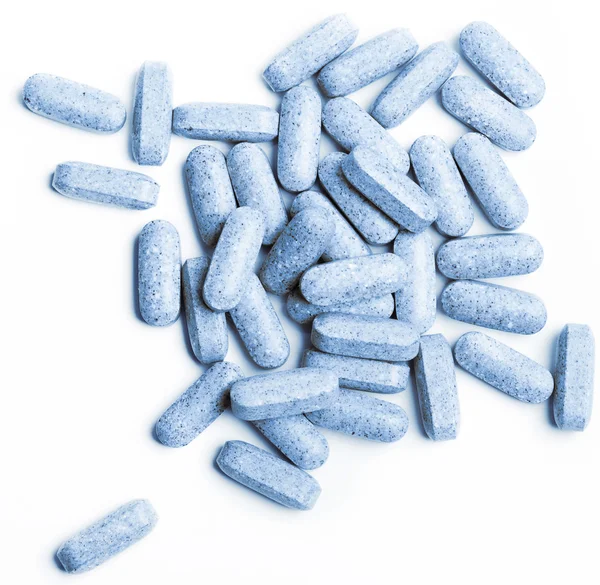 Macro of blue pills isolated on white ba — Stock Photo, Image