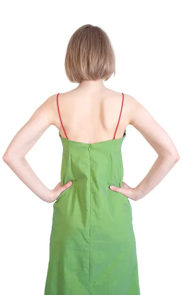 Задняя сторона молодой женщины в зеленом платье — стоковое фото