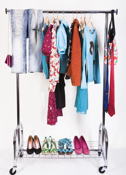 Clothing and shoes on the rack — Stock Photo, Image
