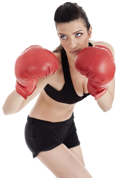 Deportiva chica en guantes de boxeo de perforación —  Fotos de Stock