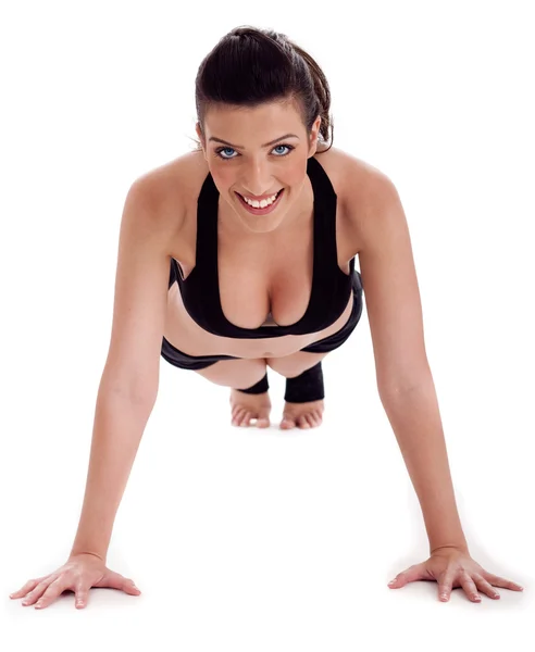 Fitness lady performs pushups — Stock fotografie