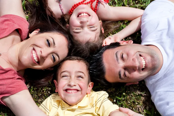 Happy family laying in the circle Stock Photo