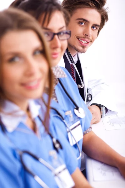 Hospital staff sitting in a row — Stock Photo, Image