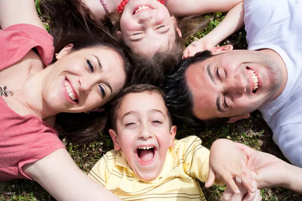 Parents and kids lying on the floor Stock Photo