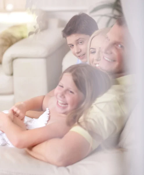 Happy family smiling and looking — Stock Photo, Image