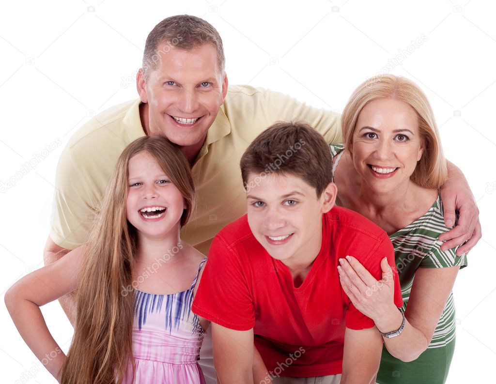 Happy family smiling towards the camera