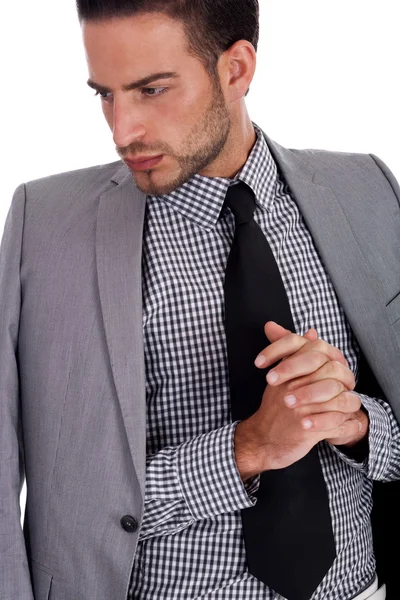 Homem de negócios sério com seu terno meio vestido — Fotografia de Stock