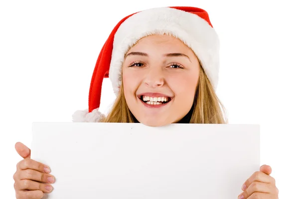 Women with santa cap smiling and holding a blank board Stock Picture