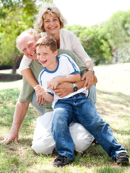 Grandparents playing with grandson — Stock Photo, Image